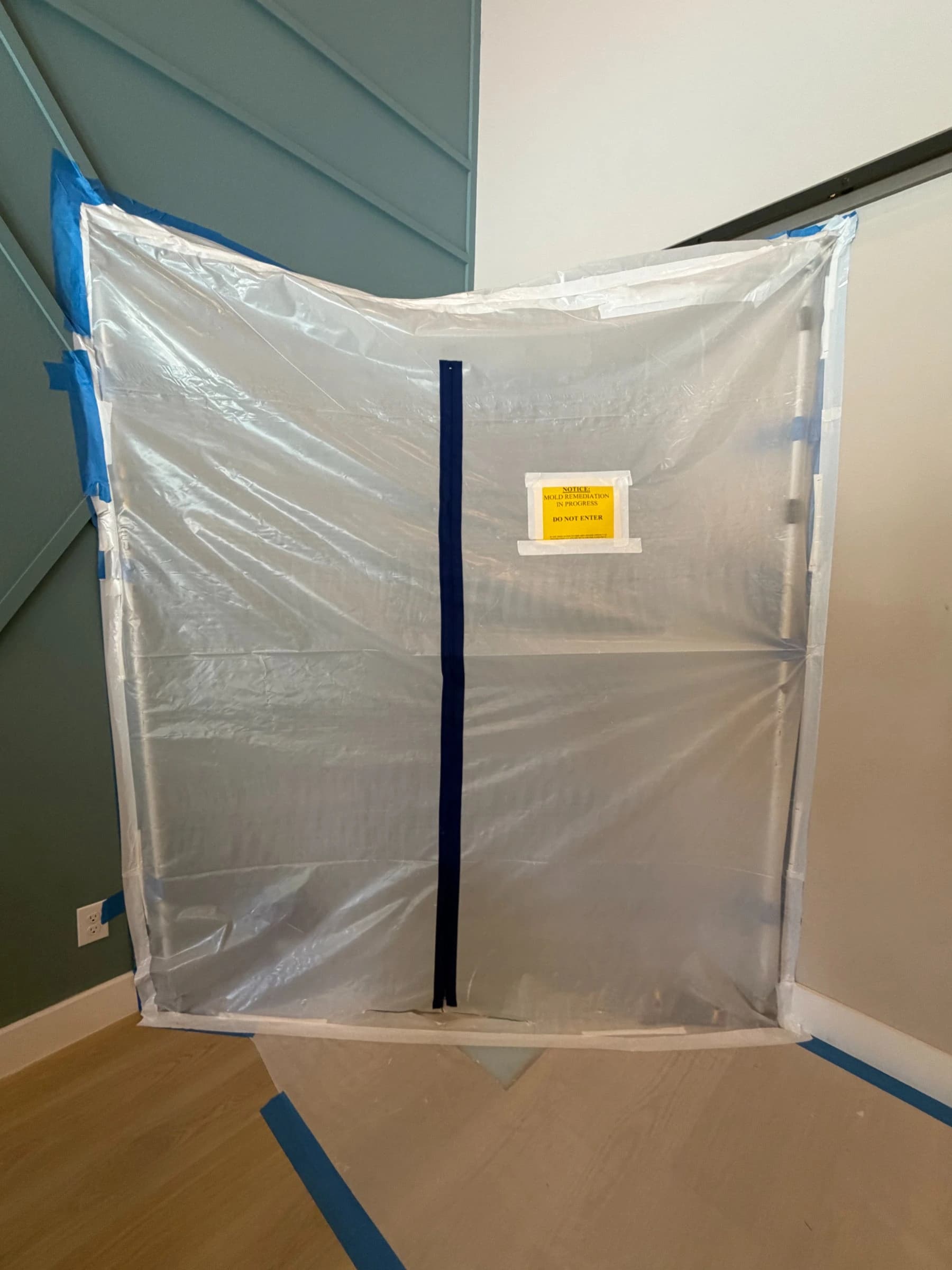 Bathroom vanity removed to studs during mold remediation inspection